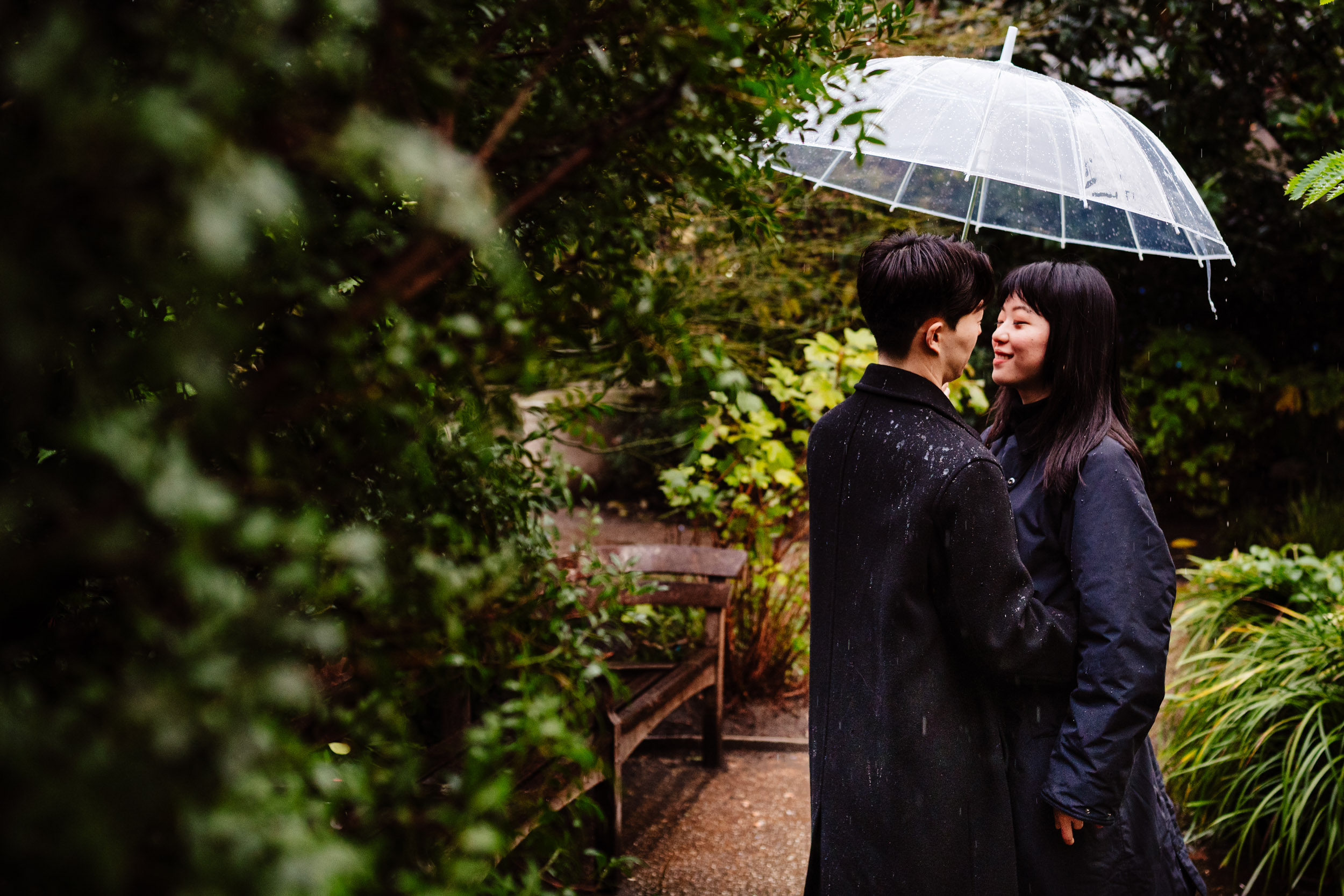 Couple smiling at each other moments after their proposal near St Paul’s Cathedral.