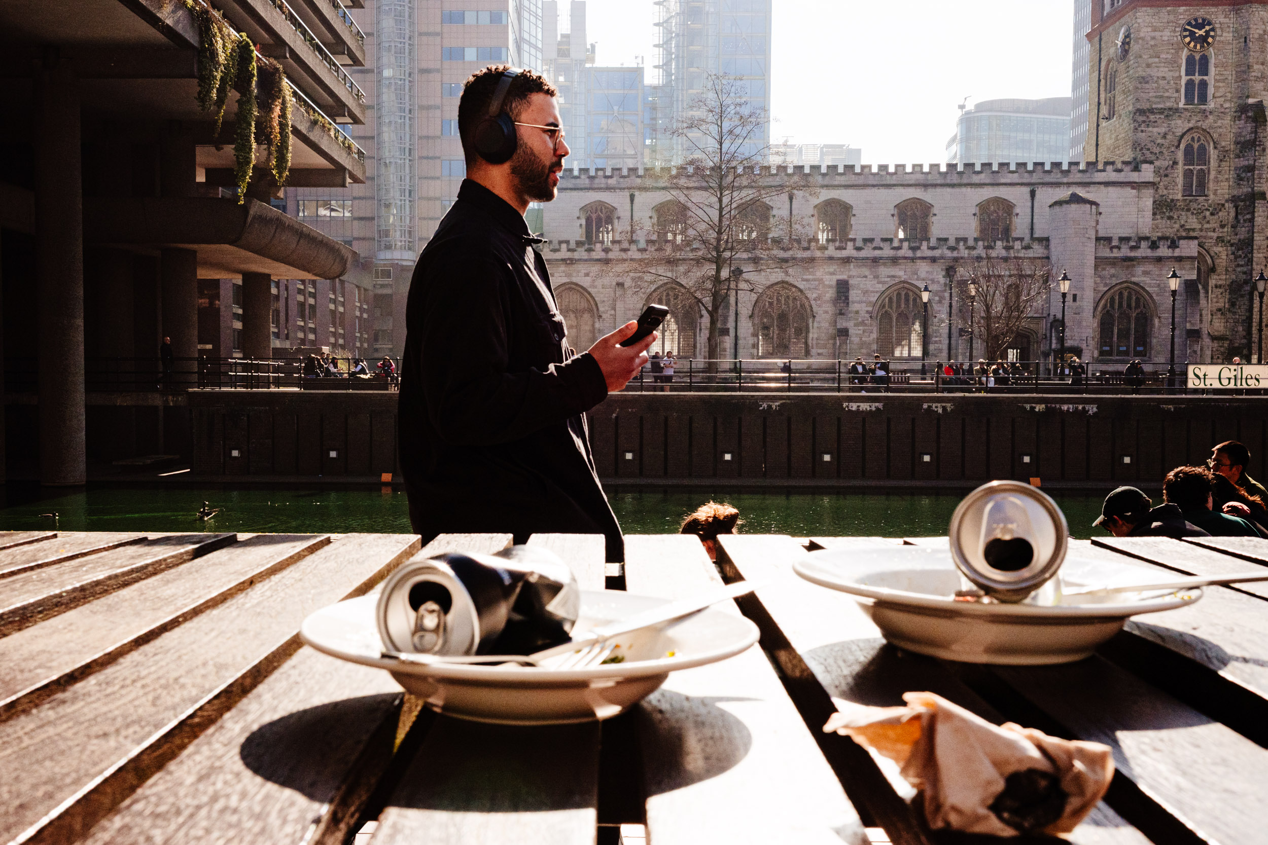 Guy walks across the path at the Barbican Centre.