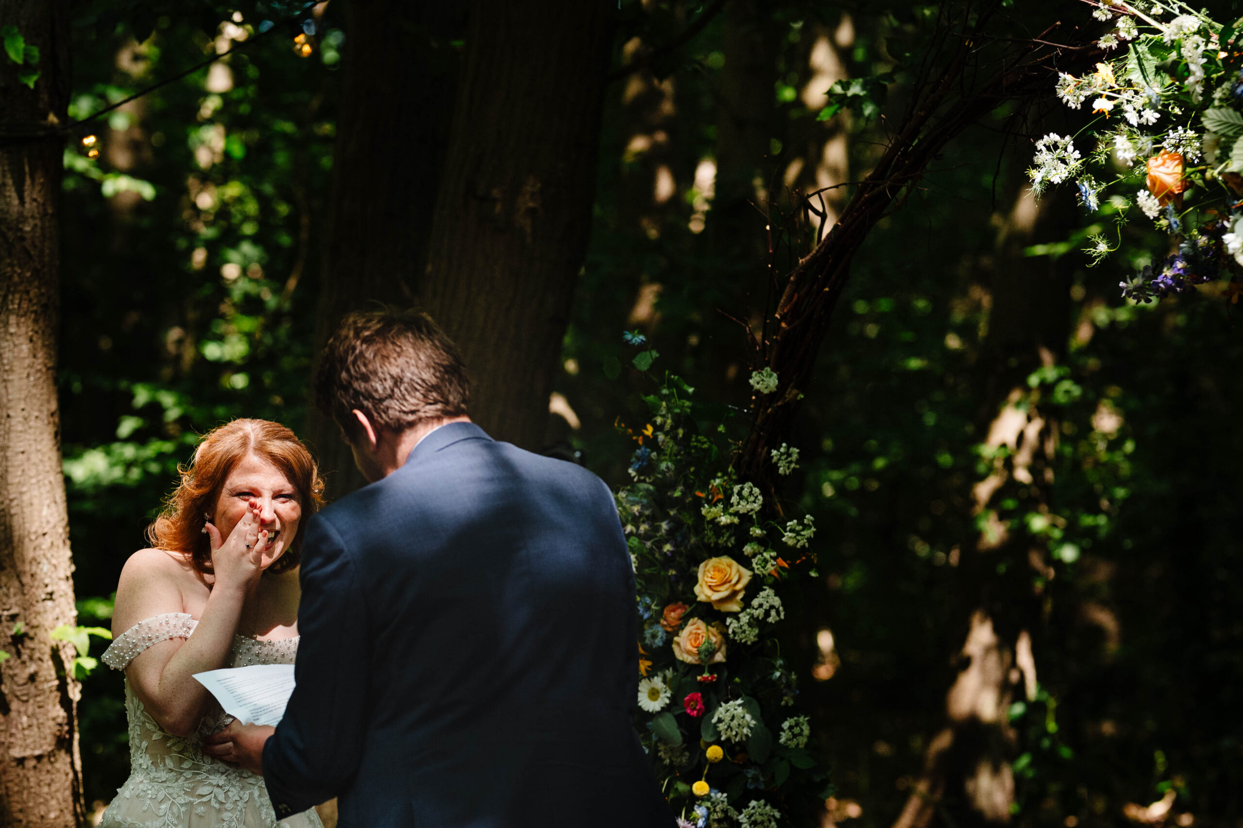 Bride and groom embracing after exchanging vows at The Dreys wedding venue.