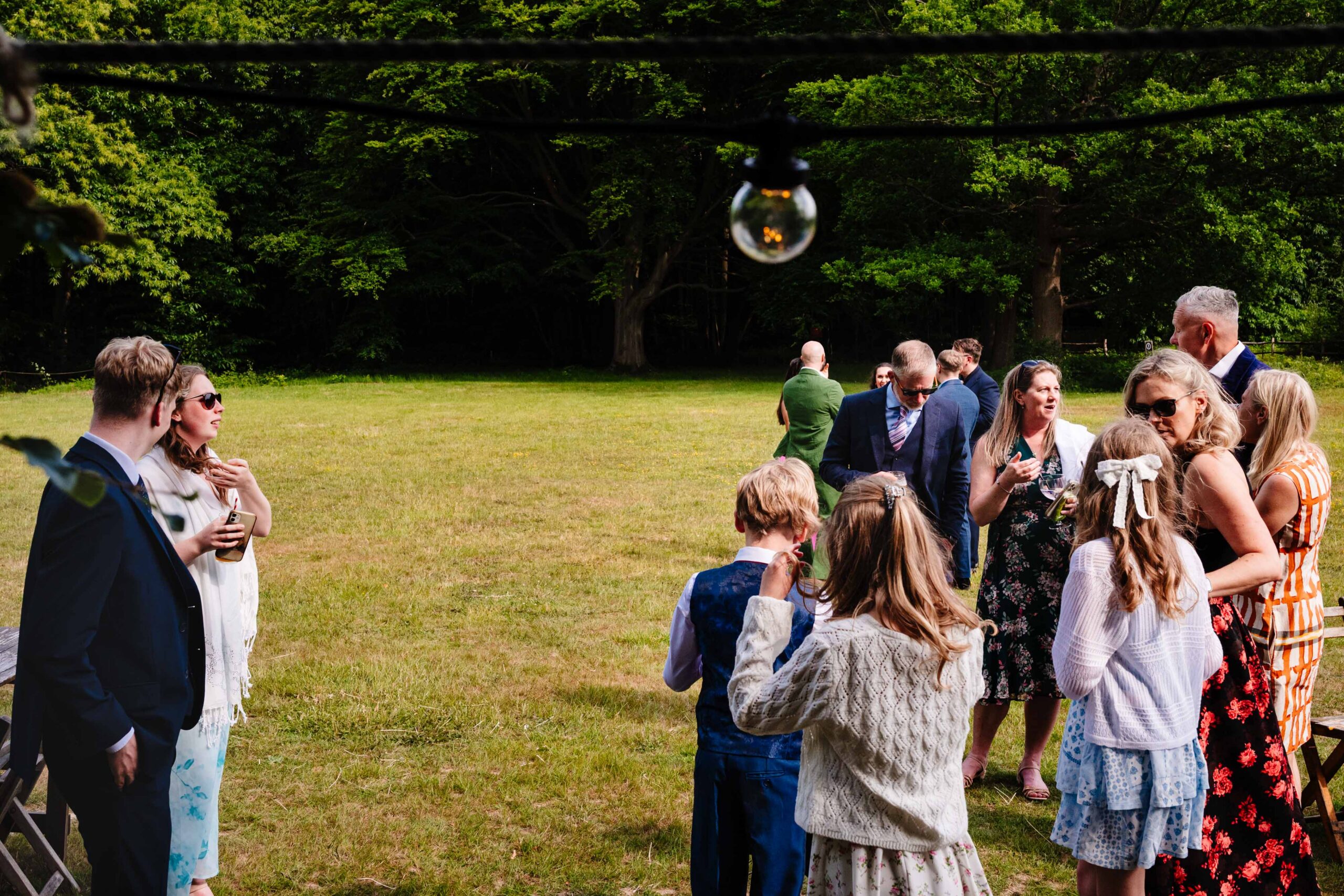Bride and groom walking through guests after their wedding ceremony at The Dreys.