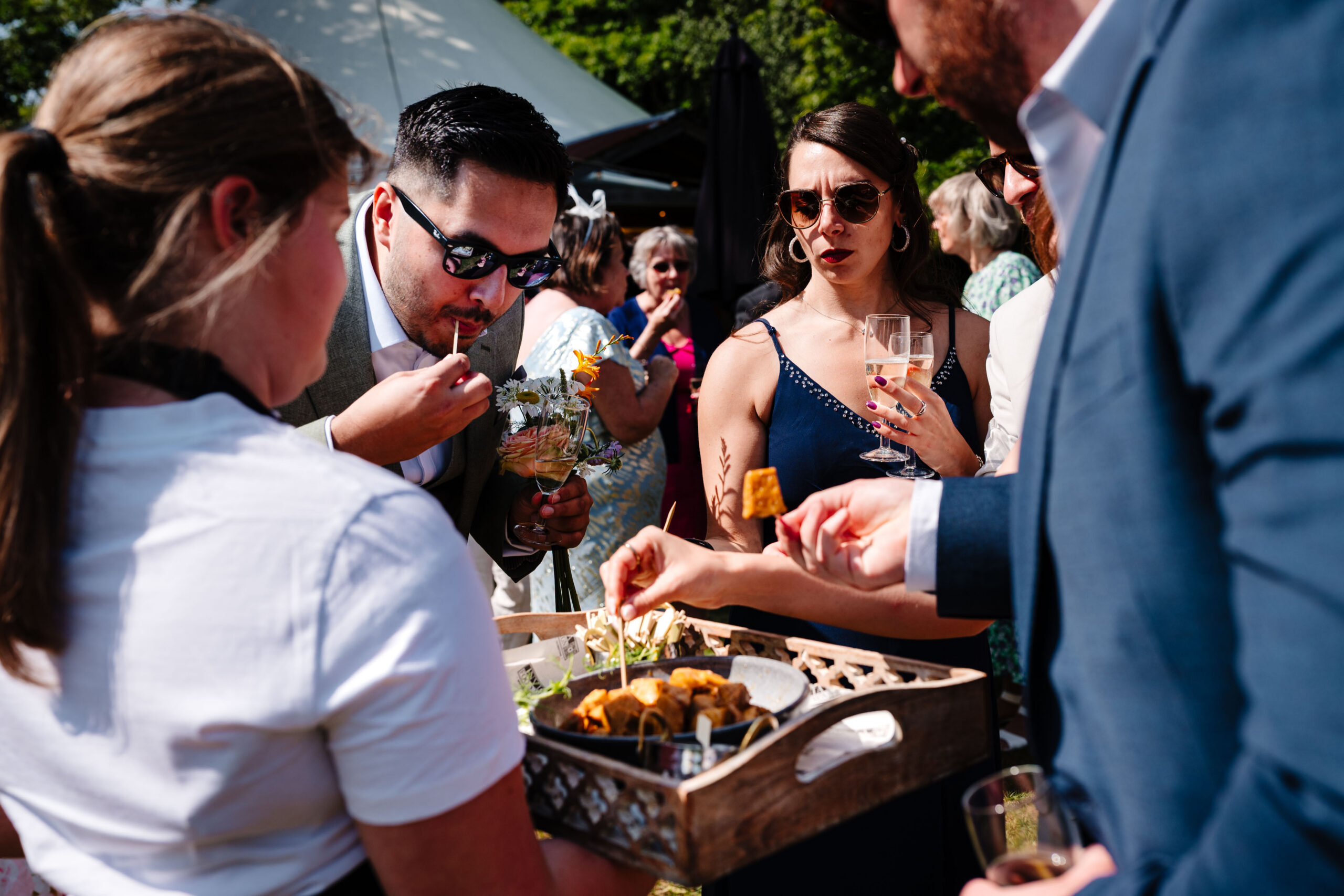 Guests enjoying canapés and drinks during a relaxed wedding reception in Kent.