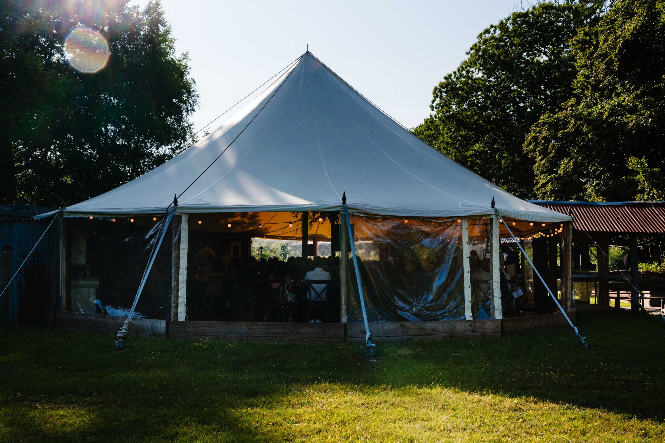 Wedding marquee at The Dreys wedding venue surrounded by woodland in Kent.