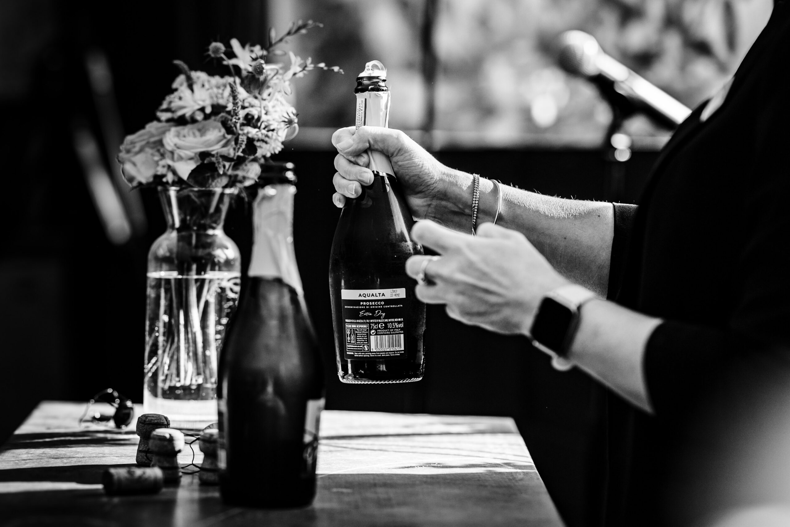 Champagne being poured during a wedding celebration at The Dreys wedding venue.