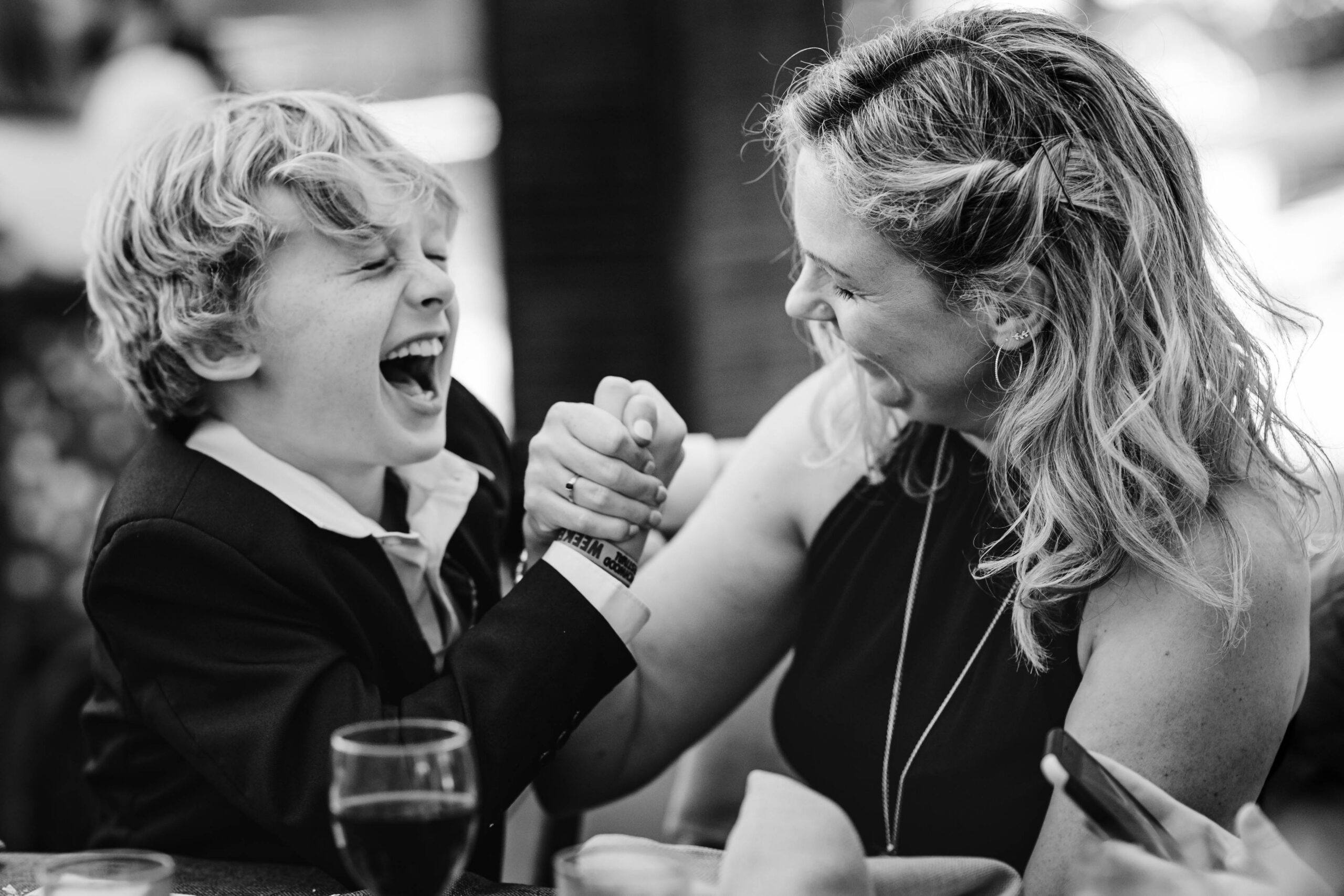 Guests arm wrestling at the wedding.