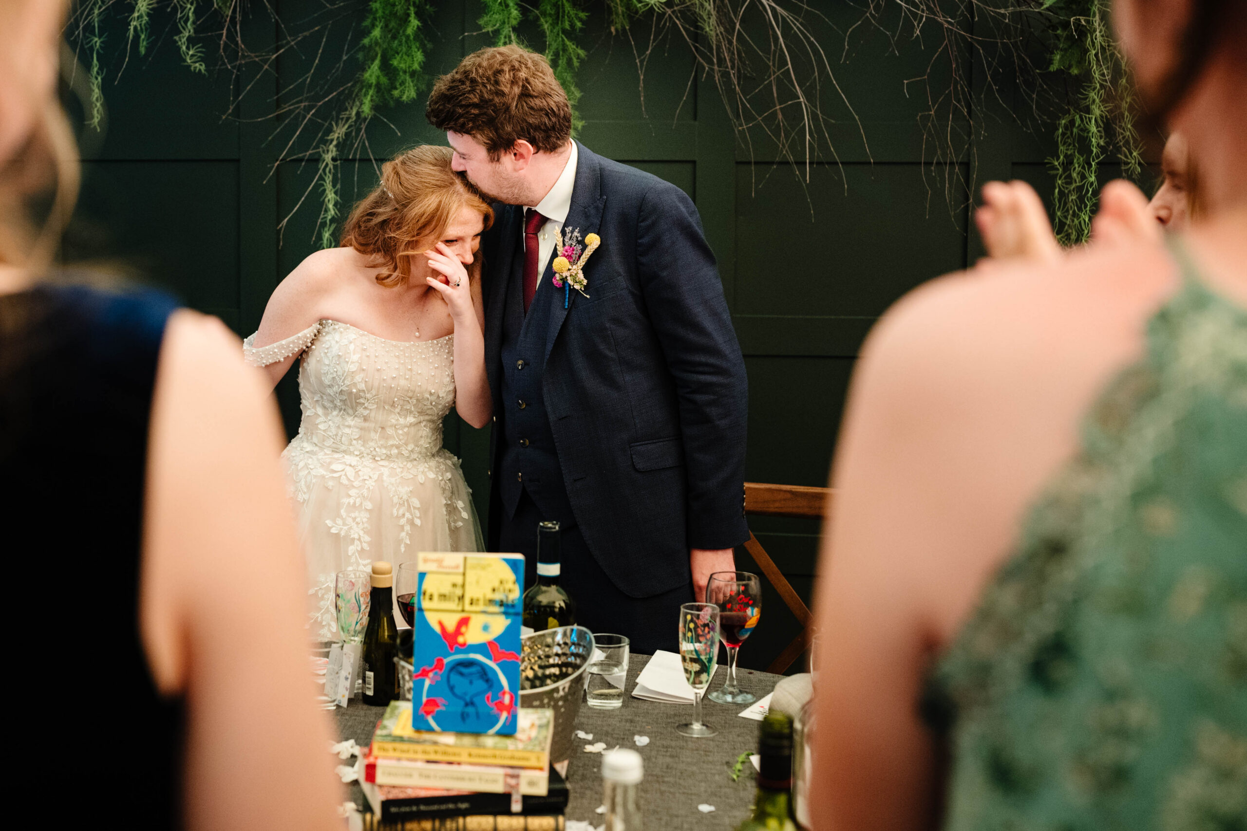 Bride and groom sharing a quiet moment during the wedding breakfast at The Dreys.