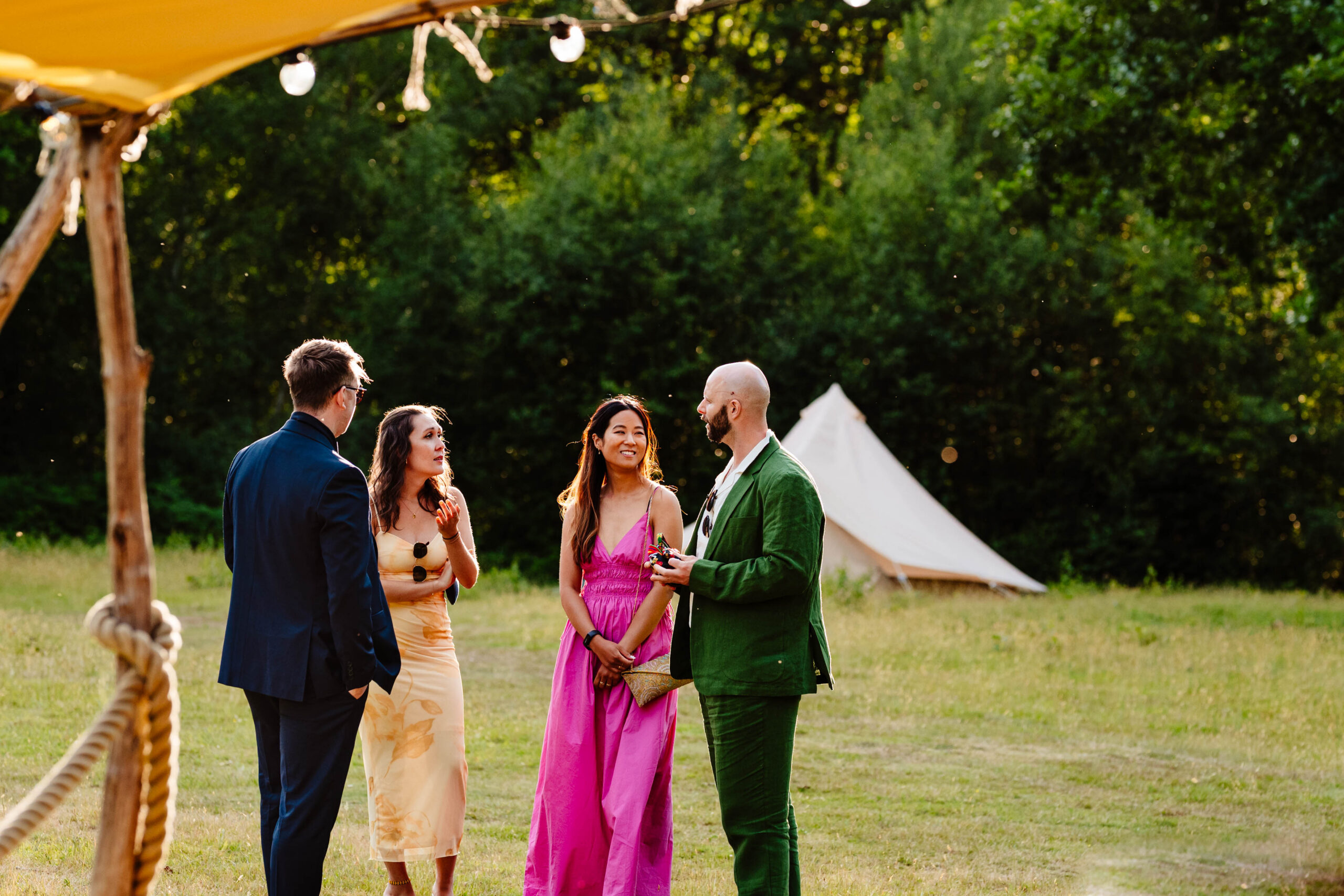 Guests relaxing outdoors during a summer wedding reception at The Dreys.