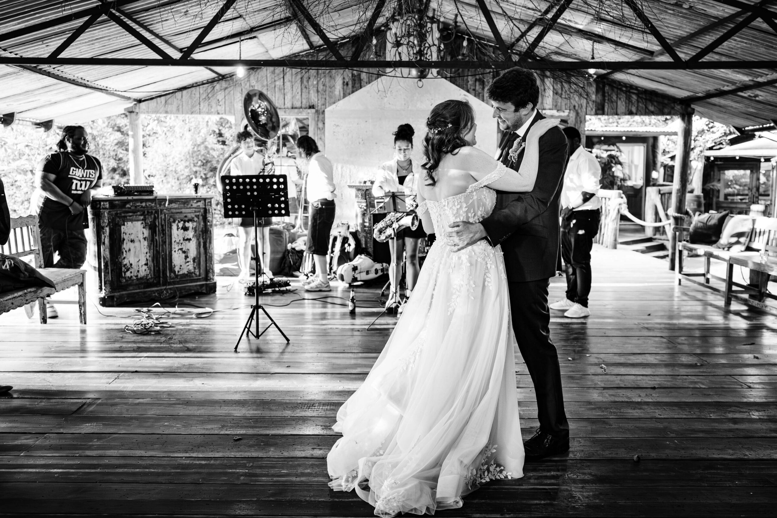 Bride and groom sharing their first dance with a live band at The Dreys.