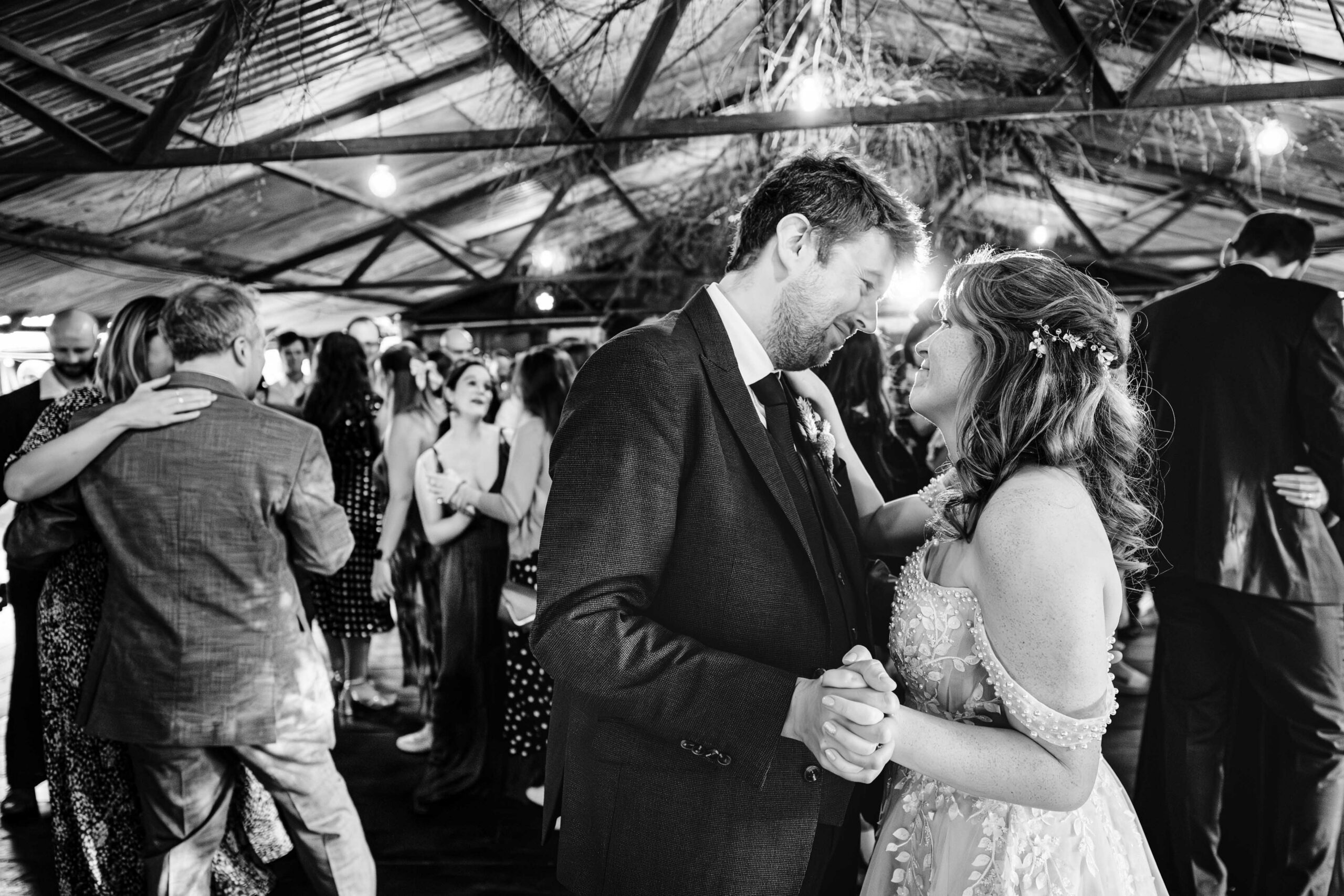 Black and white photograph of bride and groom during their first dance in Kent.
