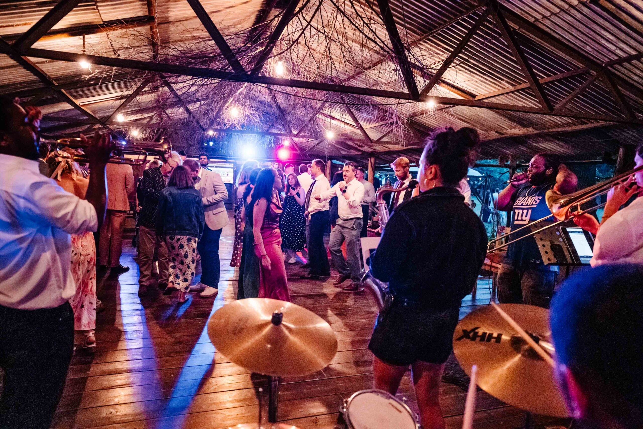 Live wedding band performing on the dance floor at The Dreys wedding venue.