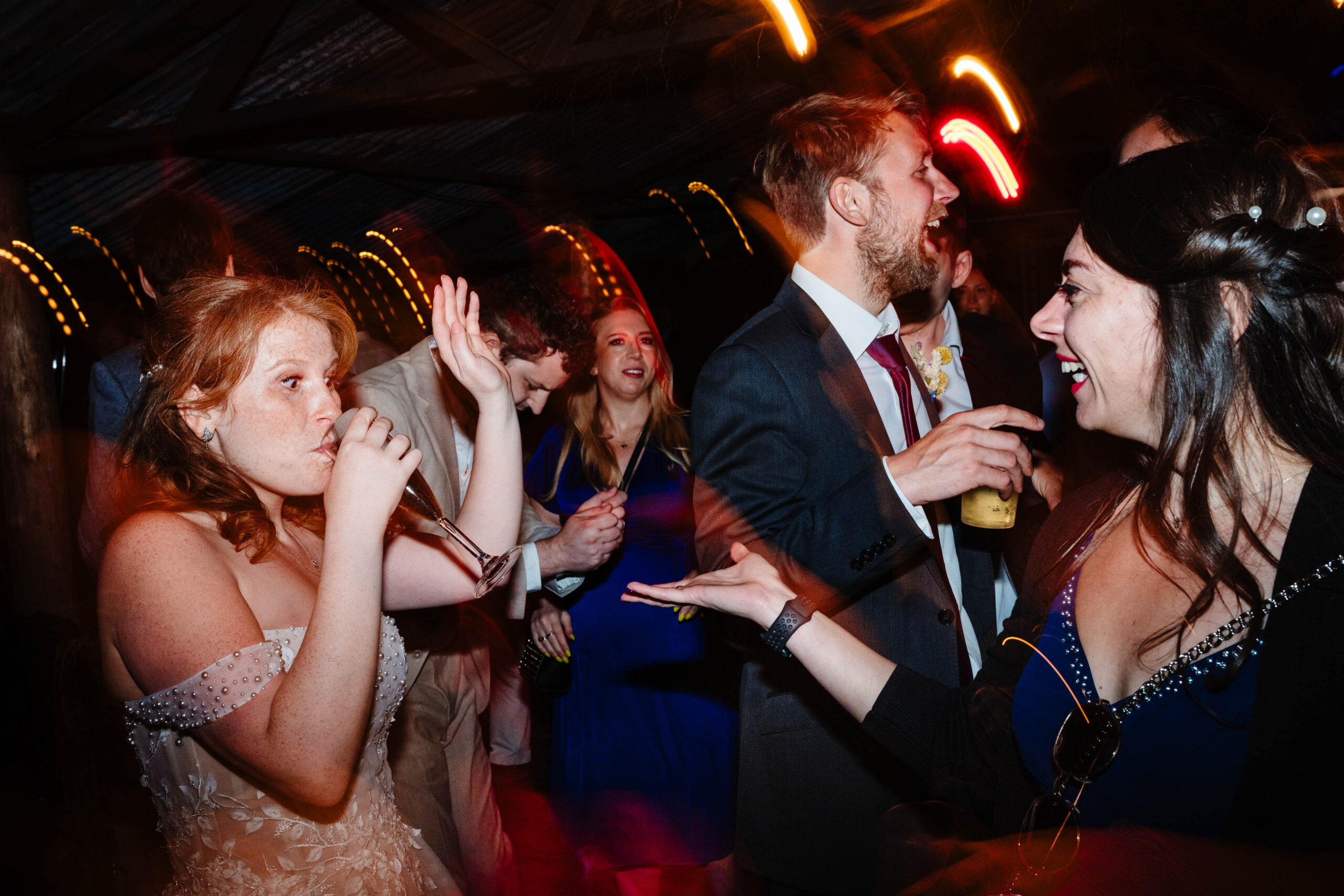 Bride enjoying the dance floor during evening wedding celebrations at The Dreys.