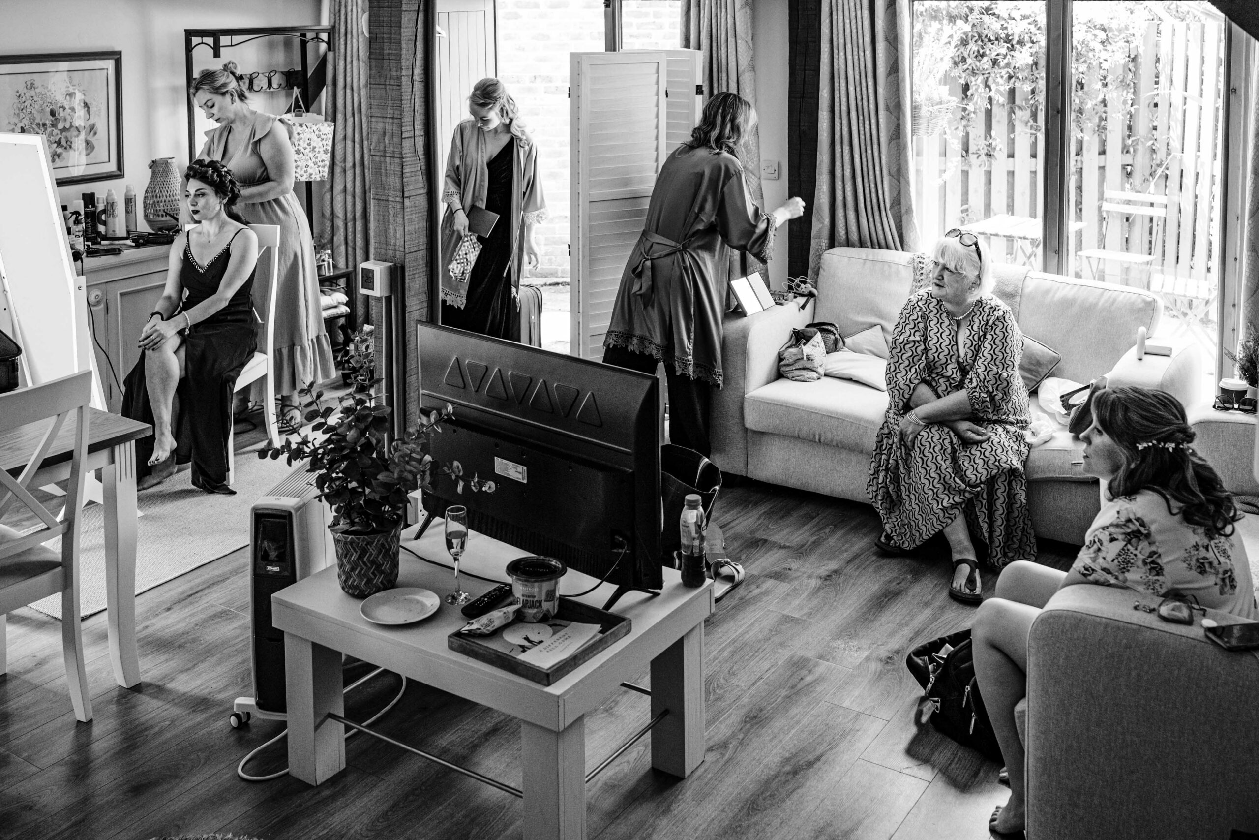 Bridal preparations in a rustic cottage before a relaxed woodland wedding in Kent.