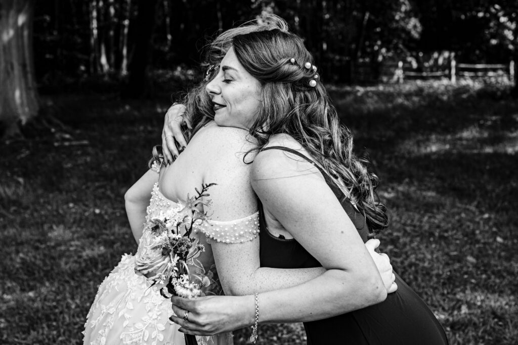 Candid moment captured in between group photos at a wedding.